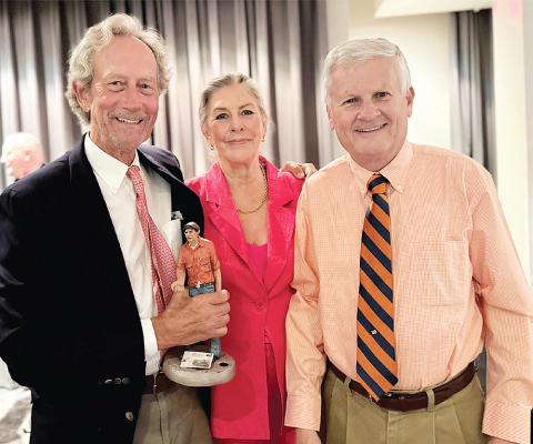 Craig Garnett (left), joined by wife Melissa Garnett, accepted the International Society of Weekly Newspaper Editors’ Eugene Cervi award at the organization’s annual conference in Cardiff, Wales, held July 15-19. At right is Chad Stebbins, executive director of the Missouri Press Association and ISWNE.