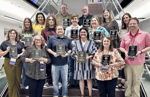 Panhandle Press Association members show off their awards in the annual PPA newspaper contest. Awards were presented at the annual convention in Amarillo. (PPA photo)