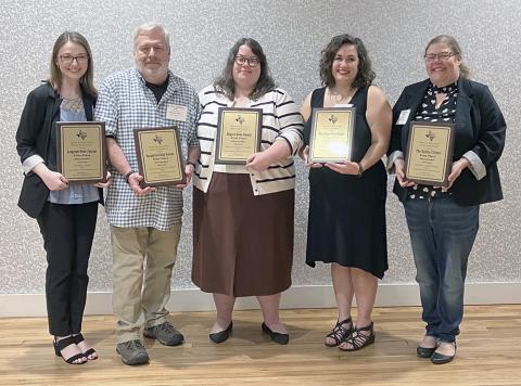 Showing off sweepstakes awards in the North and East Texas Press Association Better Newspaper Contest are (from left) Santana Gallacher accepting for the Longview News Journal in Division 1; Jeff Pownall accepting for the Nacogdoches Daily Sentinel in Division 2; Meredith Shamburger accepting for the Kilgore News Herald in Division 3; Abigail Allen, Pilot Point Post Signal in Division 4; and Wyndi Veigel, The Dublin Citizen in Division 5. The awards presentation capped the 96th NETPA convention in Nacogdoch
