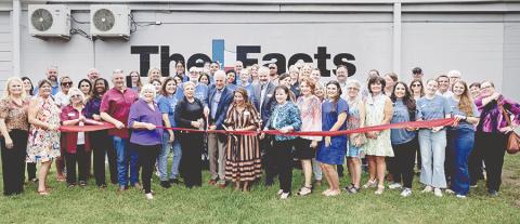 Former Facts Publisher Bill Cornwell, left, current Publisher Yvonne Mintz and Southern Newspapers Vice President Waylon Smart cut the ribbon during a ceremony at The Facts’ new office in Lake Jackson. (Mike Felix/The Facts)