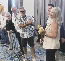 Past presidents congratulate Lisa Chappell as she accepts the president’s gavel.