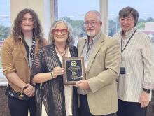 Tara Huff, publisher of The Eagle Press, was inducted into the Panhandle Press Association Hall of Fame Friday night during the annual PPA convention this weekend in Borger. On hand at the banquet held at the Phillips College Library were (from left) Creed Huff, Tara Huff and presenters PPA Secretary Roger Estlack and Deborah Wells, former owner of The Eagle Press.