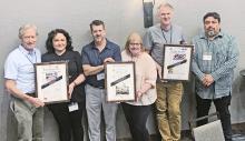 Showing off sweepstakes in their divisions of the South Texas Press Association annual contest are (from left) Craig Garnett and Meghann Garcia, Uvalde Leader-News; Ken Esten Cooke and Kim Grinke Jung, Fredericksburg Standard-Radio Post; and Marc Robertson and Manuel Azocar, Frio-Nueces Current. 