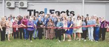 Former Facts Publisher Bill Cornwell, left, current Publisher Yvonne Mintz and Southern Newspapers Vice President Waylon Smart cut the ribbon during a ceremony at The Facts’ new office in Lake Jackson. (Mike Felix/The Facts)